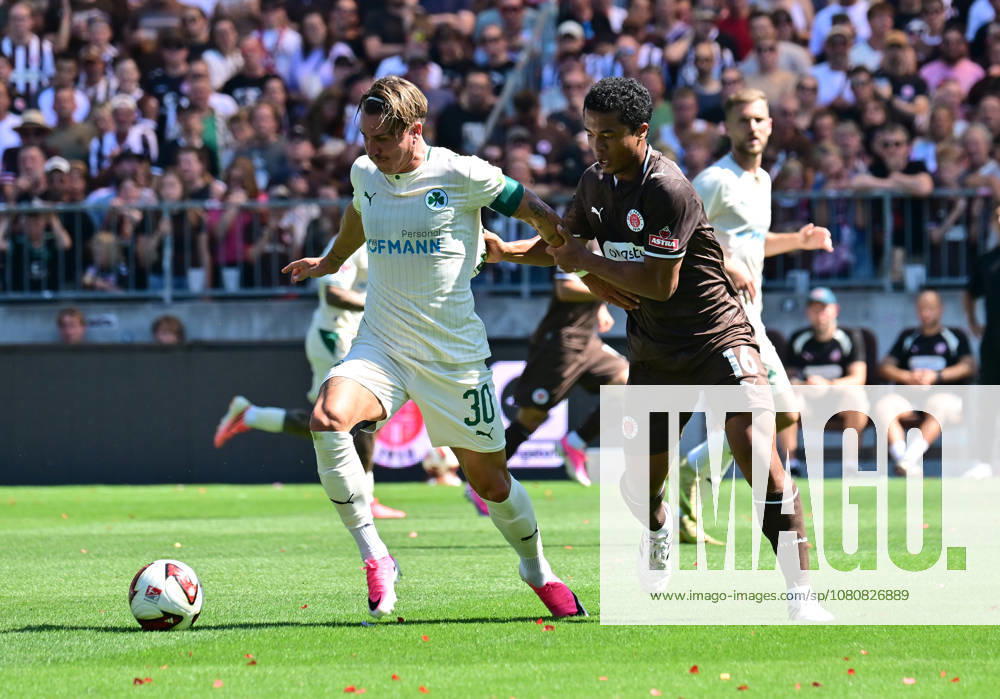 German Soccer, Men s, 2nd Division, Matchday 1, 2026–2027 Season, Hamburg, FC St. Pauli vs. SpVgg Greuther Fürth: Joel Chima Fujita (Pauli, No. 16) tries to get past Felix Klaus (Fürth, No. 30). DFB and DFL regulations prohibit any use of photographs as image sequences and or quasi-video. Hamburg Millerntorstadion, Hamburg, Germany