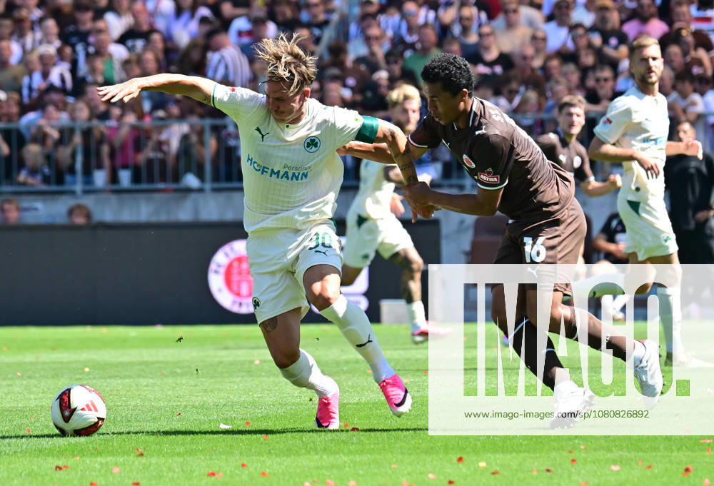 German Soccer, Men s, 2nd Division, Matchday 1, 2026–2027 Season, Hamburg, FC St. Pauli vs. SpVgg Greuther Fürth: Joel Chima Fujita (Pauli, No. 16) tries to get past Felix Klaus (Fürth, No. 30). DFB and DFL regulations prohibit any use of photographs as image sequences and or quasi-video. Hamburg Millerntorstadion, Hamburg, Germany