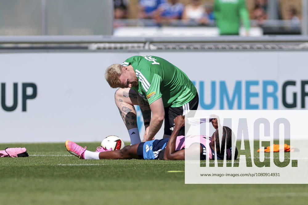 Soccer, FC Schalke 04 training session: Junior Adamu of FC Schalke 04 receives treatment on the field at the FC Schalke 04 training facility in Gelsenkirchen, North Rhine-Westphalia, Germany xRHR PHOTO YYx
