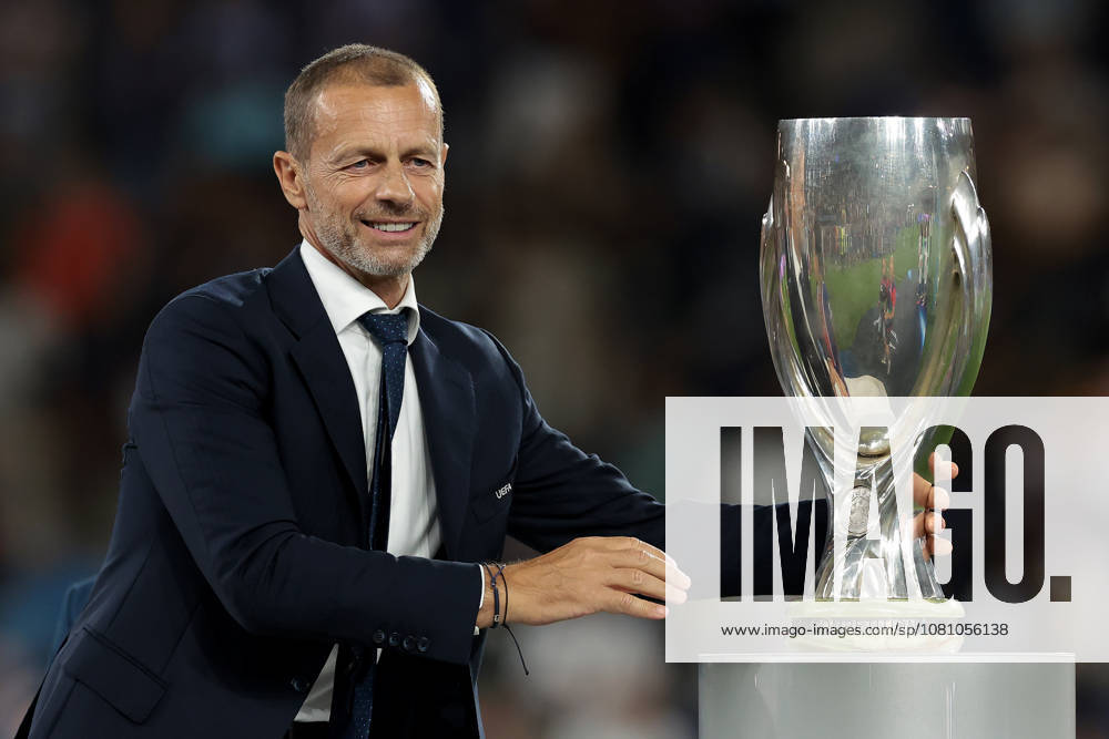 Paris Saint Germain v Aston Villa - UEFA Super Cup - Stadion Salzburg Salzburg, Austria, 12th August 2026. UEFA President Aleksander Ceferin reaches for the UEFA Supercup to present to Marquinhos of PSG following the Paris Saint Germain vs Aston Villa UEFA Super Cup match at Stadion Salzburg, Salzburg. Picture credit should read: Jonathan Moscrop Salzburg Stadion Salzburg Austria