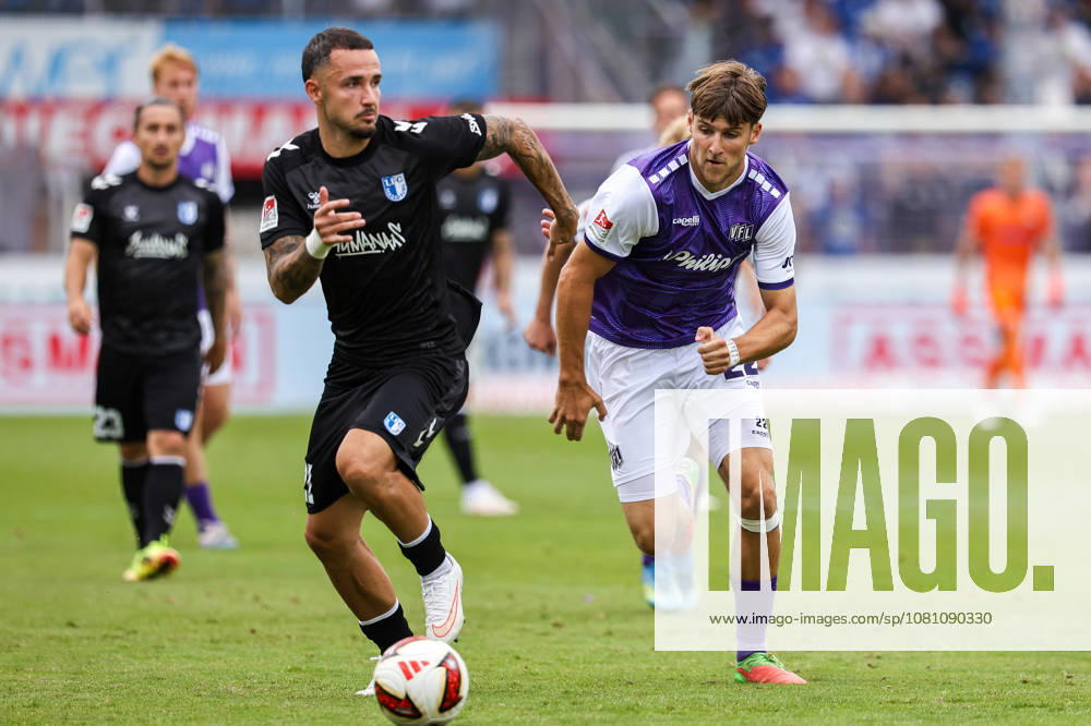 Soccer, 2. Bundesliga, VfL Osnabrück 1 FC Magdeburg, Stadion an der Bremer Brücke, Matchday 2, 2026–2027 Season: Falko Michel (1 FC Magdeburg) 21 in a tackle against Bernd Riesselmann (VfL Osnabrück) 22. DFB regulations prohibit any use of photographs as image sequences and or quasi-video. Photo: WilkowskixPressefotoKochx, Lower, Germany