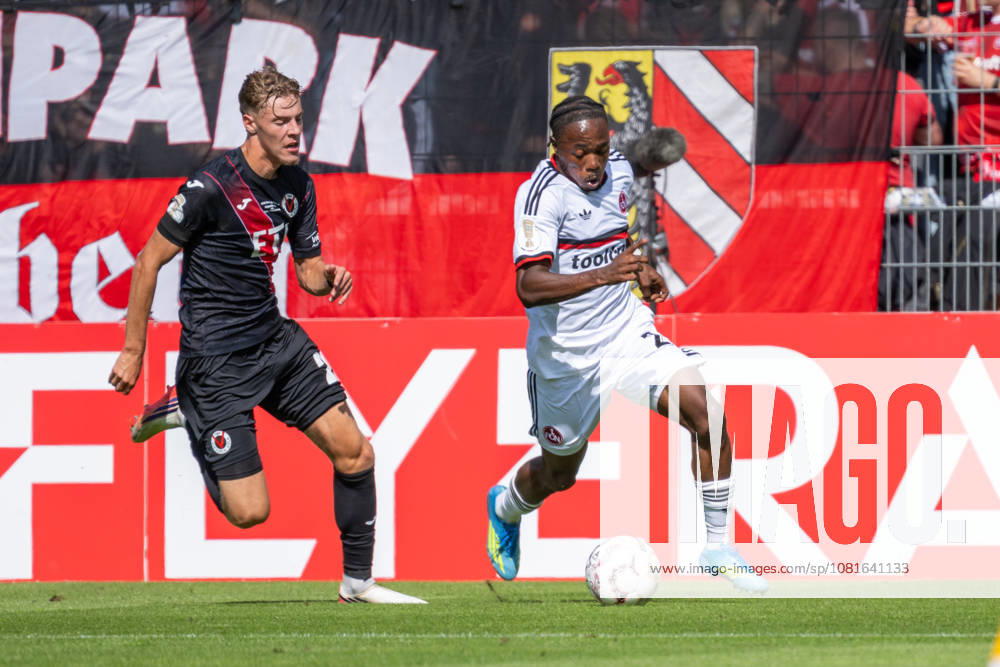 Tackle between Niklas Swider of Viktoria Cologne, 20, and Mohamed Ali Zoma of 1. FC Nuremberg, 23; Viktoria Cologne vs. 1. FC Nuremberg, Soccer, DFB Cup, 1st Round, 2026–2027 Season, August 22, 2026 DFL DFB regulations prohibit any use of photographs as image sequences and or quasi-video Viktoria Cologne vs. 1. FC Nuremberg, soccer, DFB Cup, 1st round, 2026–2027 season, August 22, 2026, Cologne