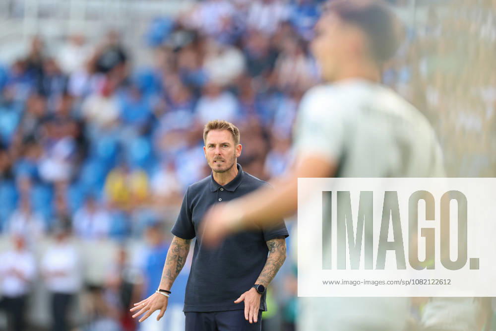 Tobias Strobl, VfL Wolfsburg, head coach, makes eye contact with Kilian Fischer, VfL Wolfsburg, 02, Karlsruher SC vs. VfL Wolfsburg, 2. Bundesliga, Matchday 3, 2026–2027, August 29, 2026, DFL regulations prohibit any use of photographs as image sequences and or quasi-video, Karlsruher SC vs. VfL Wolfsburg, 2. Bundesliga, Matchday 3, 2026–2027, August 29, 2026, Karlsruhe