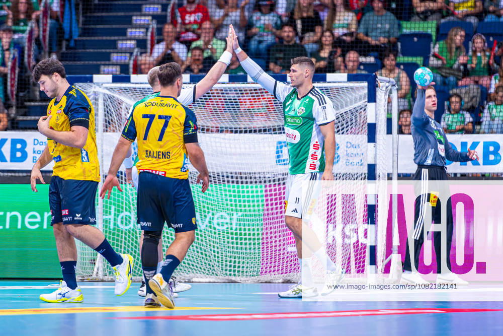 Sebastian Heymann of TSV Hannover Burgdorf, No. 11 from the left, TSV Hannover Burgdorf (green) vs. Rhein Neckar Löwen (yellow) on Matchday 1 of the 2026–2027 season in the Opel Handball Bundesliga, August 30, 2026, ZAG Arena Hannover, GER,