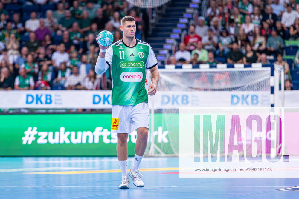 Sebastian Heymann of TSV Hannover Burgdorf, No. 11 from the left, TSV Hannover Burgdorf (green) vs. Rhein Neckar Löwen (yellow) on Matchday 1 of the 2026–2027 season in the Opel Handball Bundesliga, August 30, 2026, ZAG Arena Hannover, GER,
