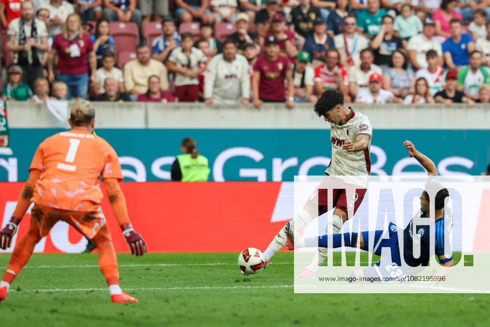 Rodrigo Ribeiro (9, FC Augsburg) scores the goal to make it 3–0; Soufiane El Faouzi (23, FC Schalke 04) and Loris Karius (1, FC Schalke 04) are powerless to stop it. FC Augsburg vs. FC Schalke 04, Soccer, Bundesliga 1, Matchday 1, August 30, 2026. DFB regulations prohibit any use of photographs as image sequences and or quasi-videos. Augsburg, Bavaria, Germany