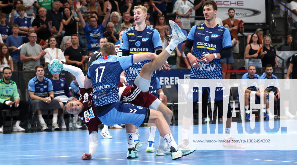 Germany, Stuttgart, Handball: TVB Stuttgart vs. Füchse Berlin; from left: Mathias Gidsel (Berlin), Samuel Röthlisberger (TVB), Torben Matzken (TVB), Philipp Meyer (Berlin)