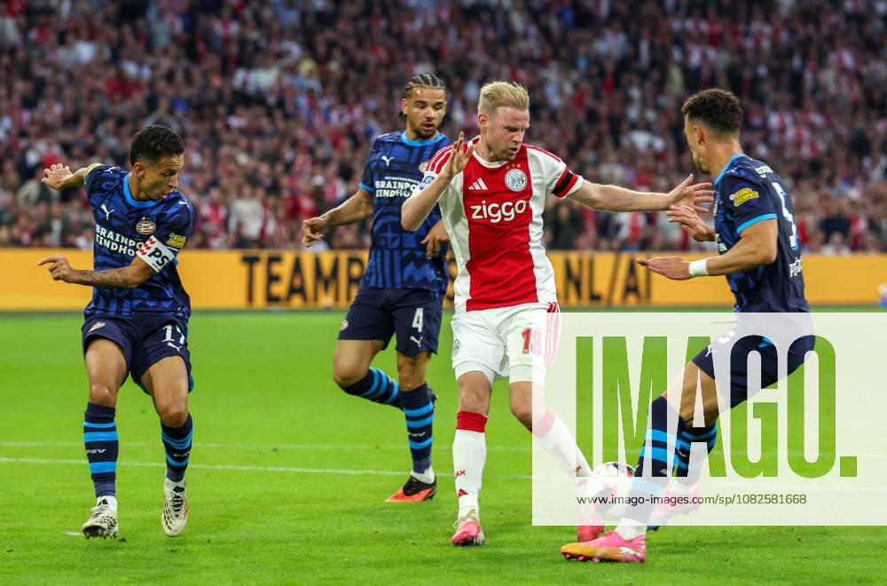 AMSTERDAM: AFC Ajax Amsterdam midfielder Davy Klaassen with PSV Eindhoven forward Ivan Perisic and PSV Eindhoven defender Mauro Junior during the Vriendenloterij Eredivisie match between Ajax and PSV at the Johan Cruijff ArenA on September 5, 2026, in Amsterdam, Netherlands PETER LOUS EYE4IMAGES DeFodi Images