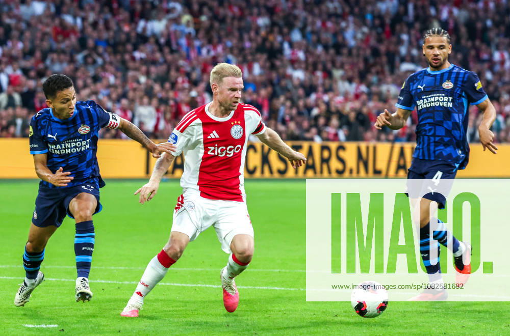 AMSTERDAM: AFC Ajax Amsterdam midfielder Davy Klaassen with PSV Eindhoven defender Mauro Junior and PSV Eindhoven defender Armando Obispo during the Vriendenloterij Eredivisie match between Ajax and PSV at the Johan Cruijff ArenA on September 5, 2026, in Amsterdam, Netherlands PETER LOUS EYE4IMAGES DeFodi Images