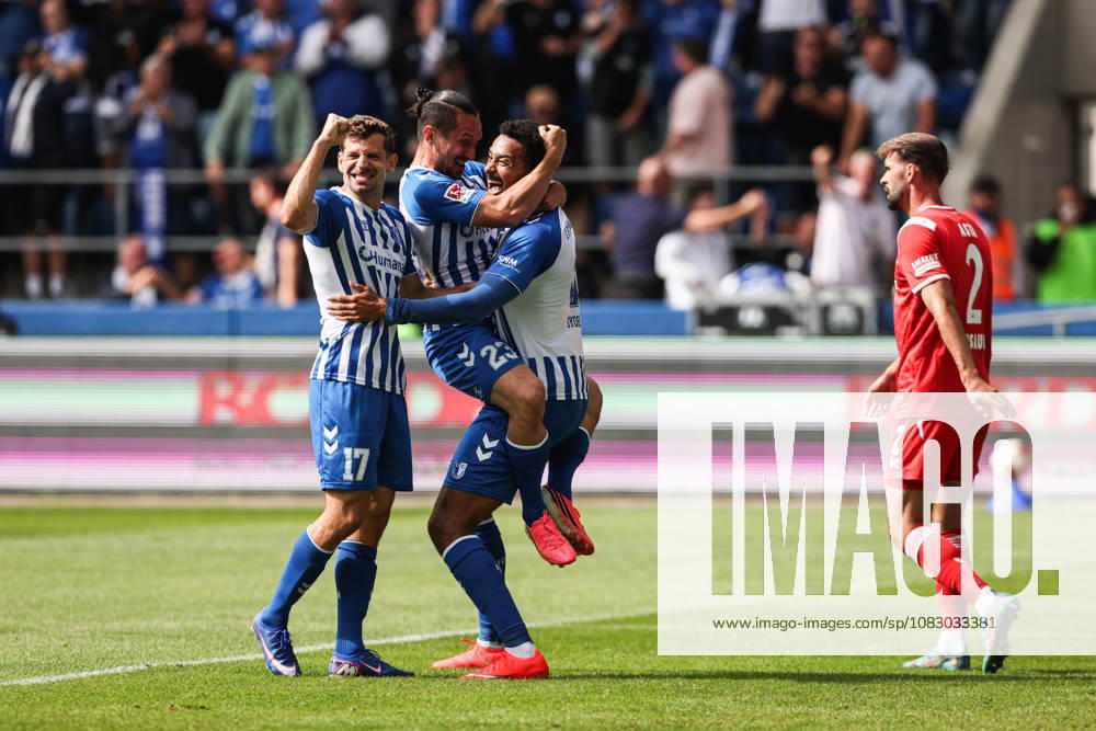 Goal celebration: Goal scorer Emmanuel Iyoha (1 FC Magdeburg, 8) scores the 1-0 goal with Baris Atik (1 FC Magdeburg, 23) and Alexander Nollenberger (1 FC Magdeburg,17, 2026–2027 Bundesliga season: 1 FC Magdeburg vs. 1 FC Kaiserslautern at the Avnet Arena in Magdeburg; action, soccer, man, men, Germany