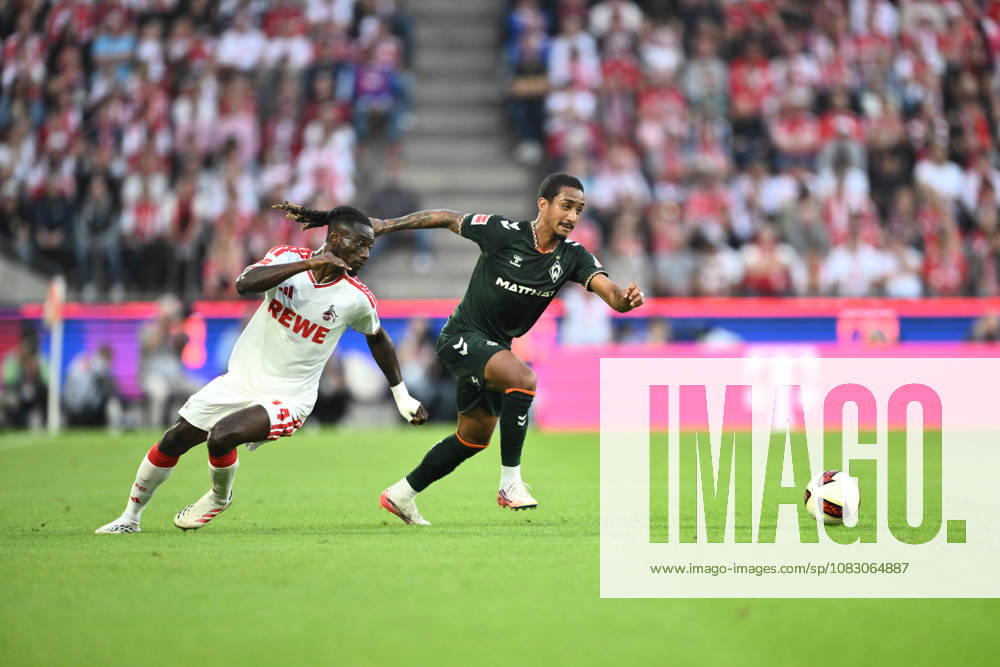GER, Soccer, Men s, 1. Bundesliga, 2026–2027 Season, Matchday 3, 1. FC Köln vs. SV Werder Bremen Arthur Werder Bremen, 13 in a tackle with Gideon Mensah of 1. FC Köln, 14 DFB and DFL regulations prohibit any use of photographs as image sequences and or quasi-video. Köln Rhein Energie Stadium, NRW, Germany