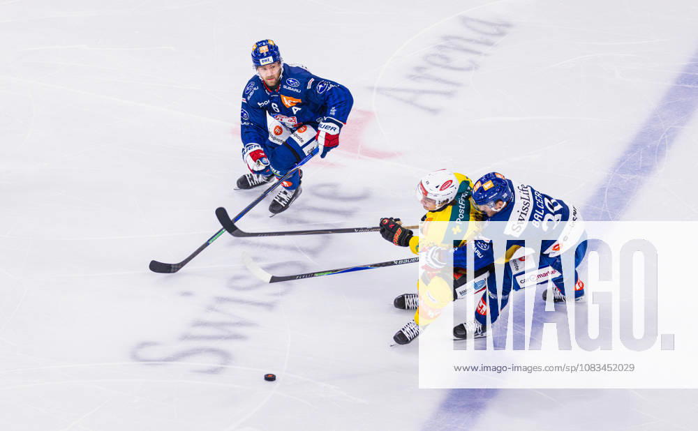 Ice Hockey National League Regular Season: ZSC Lions vs. SC Ber Zurich, Switzerland, September 15, 2026. No. 38 Rudolf Balcers of the ZSC Lions battles against No. 23 Marco Lehmann, a defenseman for Bern. No. 6 Yannick Weber of the ZSC Lions comes in to provide support.
