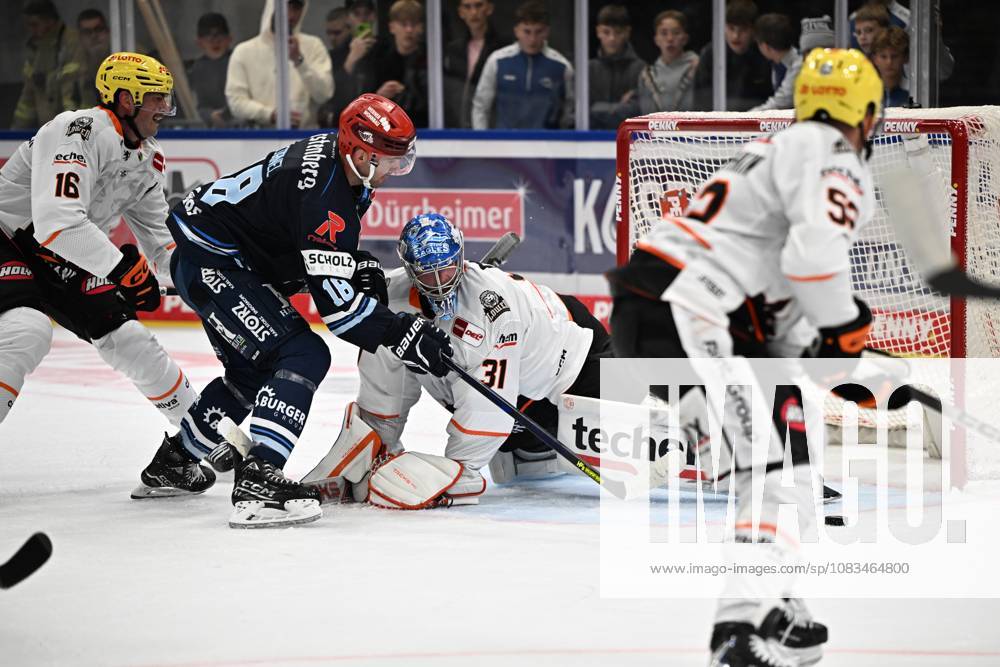 From left to right: Eric Cornel (Schwenninger Wild Wings) 18, Adam Scheel (Loewen Frankfurt) 31, blocks a shot. Schwenninger Wild Wings vs. Loewen Frankfurt, DEL, Regular Season, Game 1, 2026–2027 Season, 20260918 Schwenninger Wild Wings vs. Loewen Frankfurt, DEL, Regular Season, Game 1, 2026–2027 Season, 20260918 Schwenningen