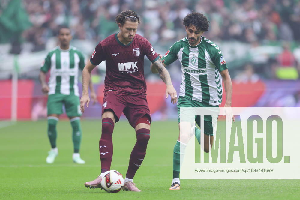 Calvin Brackelmann of FC Augsburg and Eren Dinkci of Werder Bremen battle for the ball during the Bundesliga match between SV Werder Bremen and FC Augsburg at Weserstadion on September 19, 2026, in Bremen, Germany Photo by Marco Steinbrenner, DeFodi Images Calvin Brackelmann of FC Augsburg and Eren Dinkci of Werder Bremen battle for the ball during the Bundesliga match between SV Werder Bremen and FC Augsburg at Weserstadion on September 19, 2026 in Bremen, Germany. Photo by Marco Steinbrenner, DeFodi Images. DFB and DFL regulations prohibit any use of photographs as image sequences and or quasi-video. Photo by Marco Steinbrenner, DeFodi Images.