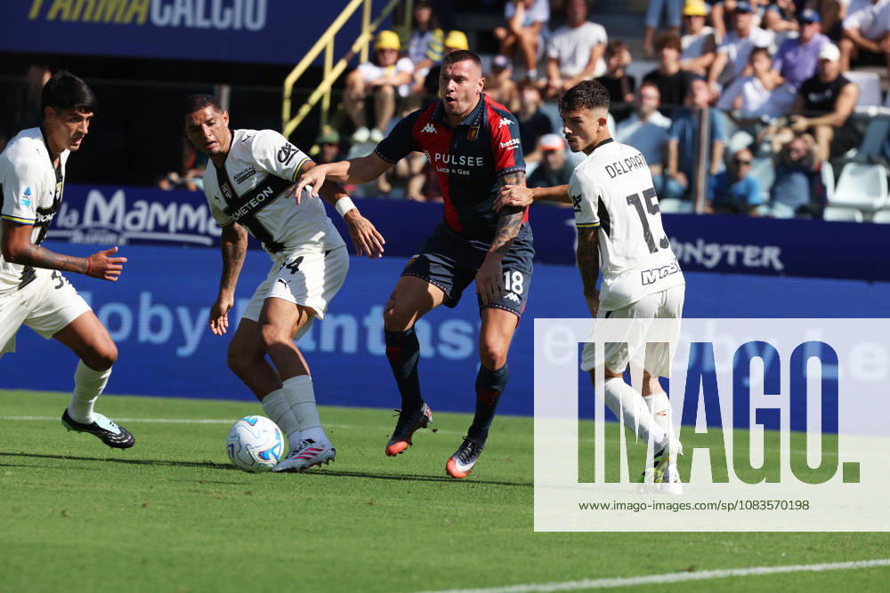 Genoas Milutin Osmajic fights for the ball with Parmas Enrico Delprato and Emanuele Valeri during the Serie A soccer match between Parma and Genoa at the Ennio Tardini Stadium in Parma, north west Italy - September 20, 2026. - Soccer