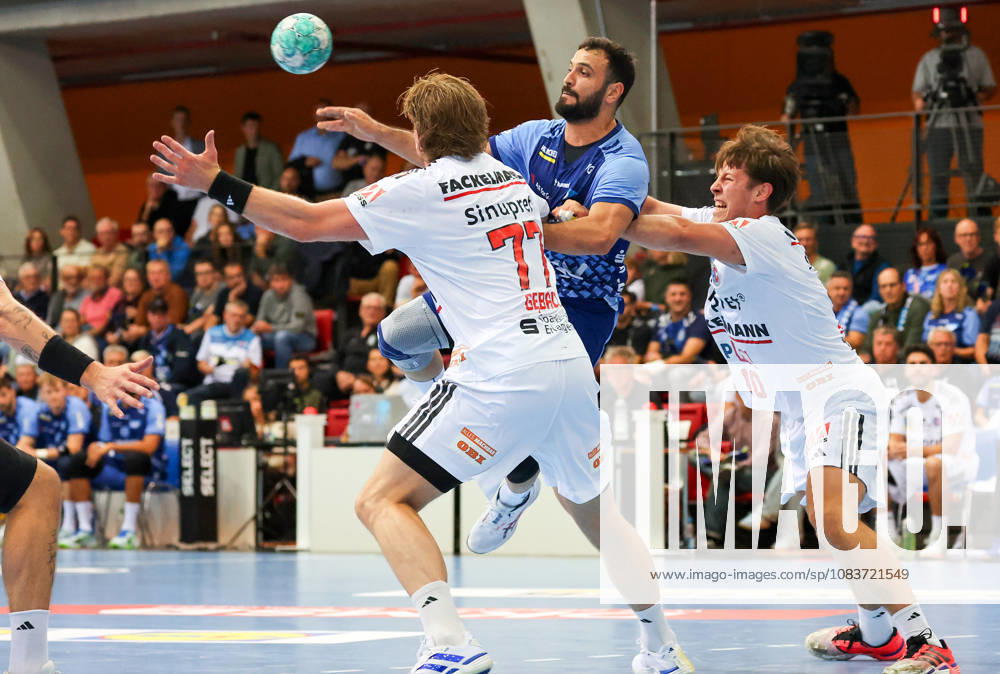 Germany, Stuttgart, DHB Cup 2026–2027 Season, TVB Stuttgart vs. HC Erlangen, from left: Maciej Gebala (HCE), Dario Sanz de Nicolas (TVB), Florian Scheerer (HCE)