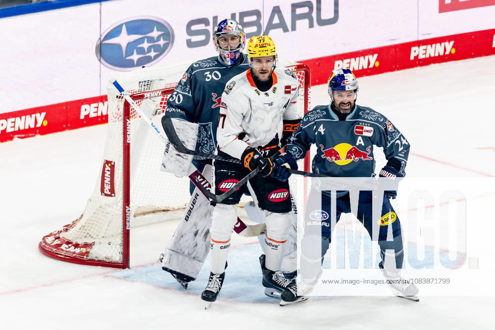 Ryan Murphy (EHC Red Bull Munich), No. 24, defends against Daniel Pfaffengut (Loewen Frankfurt), No. 77, in front of the goal of Antoine Bibeau, goaltender for EHC Red Bull Munich, No. 30 (GER), EHC Red Bull Munich vs. Löwen Frankfurt Ice Hockey, DEL, 2026–2027 Season, Matchday 4, September 27, 2026 Photo by HMB Media, Franz Feiner