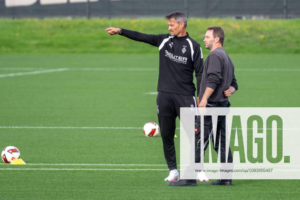 Alexander Blessin of Borussia Mönchengladbach, coach, talking with a groundskeeper before practice. Borussia Mönchengladbach open practice, soccer, Bundesliga, 2026–2027 season, September 29, 2026, Borussia Mönchengladbach open training session, soccer, Bundesliga, 2026–2027 season, September 29, 2026, Mönchengladbach