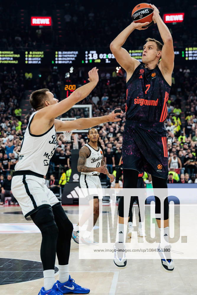 Johannes Jo Voigtmann (FC Bayern Muenchen, 7) shooting the ball against Arijan Lakic (Partizan Mozzart Bet Belgrade, 19) during the Turkish Airlines EuroLeague match between FC Bayern Muenchen vs. Partizan Mozzart Bet Belgrade at SAP Garden on round 3 of Turkish Airlines EuroLeague on October 02, 2026 in Munich, Germany. Bavaria Germany