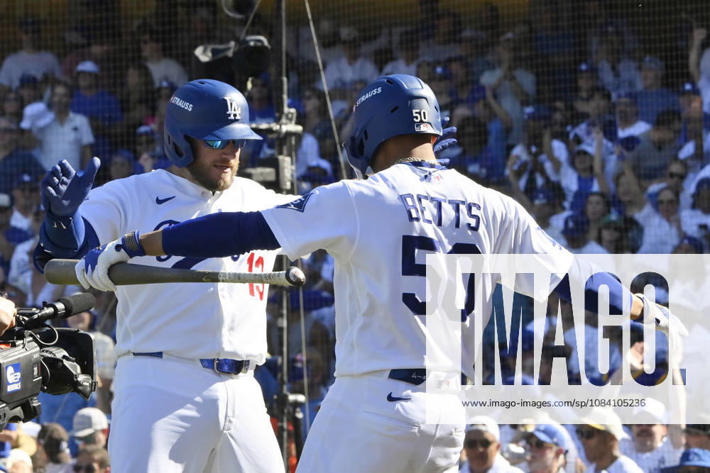 Los Angeles Dodgers Max Muncy celebrates with Mookie Betts after hitting a solo home run in the sixth inning against the Atlanta Braves in game one of the National League Division Series at Dodger Stadium on Saturday, October 3, 2026 in Los Angeles, California. LAP202610033052 JIMxRUYMEN