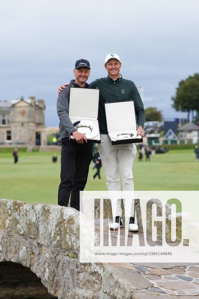 4th October 2026; Old Course at St Andrews, St Andrews, Scotland; DP World Tour Golf, Alfred Dunhill Links Championship, Final Day; Tom Chaplin and Adrian Meronk hold the team championship trophy on the Swilcan Bridge AlecxBrown