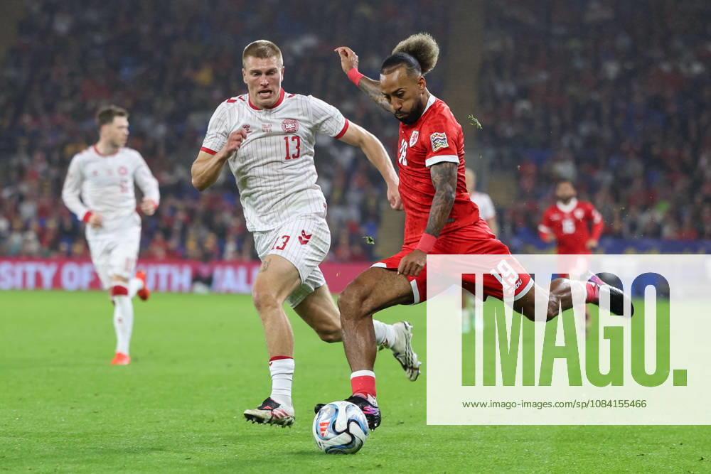 Wales v Denmark UEFA Nations League Sorba Thomas of Wales crosses the ball with pressure from Rasmus Kristensen of Denmark during the UEFA Nations League match at the Cardiff City Stadium, Cardiff 04 10 2026 UK Newspapers OUT