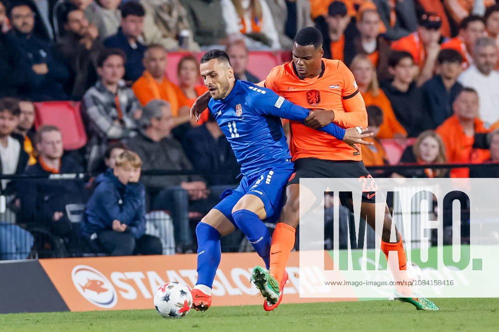 Filip Kostic of Serbia battles for the ball with Denzel Dumfries of Netherlands during the UEFA Nations League 2026 27 Group A2 MD4 match between Netherlands and Serbia at Philips Stadion on October 04, 2026 in Eindhoven, Netherlands.