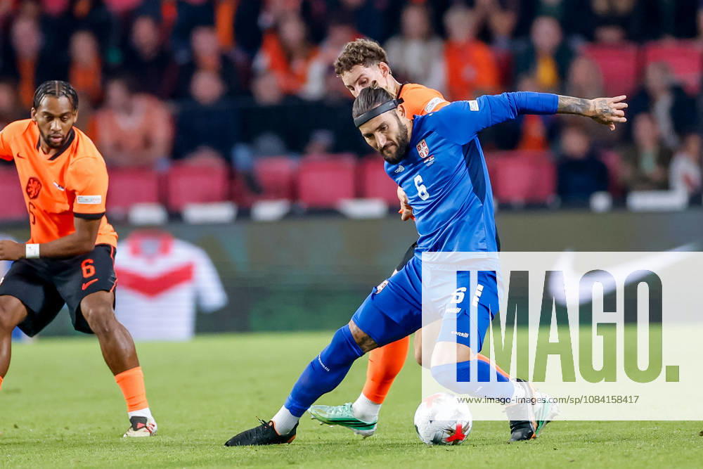 Nemanja Gudelj of Serbia is challenged by Ruben van Bommel of Netherlands during the UEFA Nations League 2026 27 Group A2 MD4 match between Netherlands and Serbia at Philips Stadion on October 04, 2026 in Eindhoven, Netherlands.