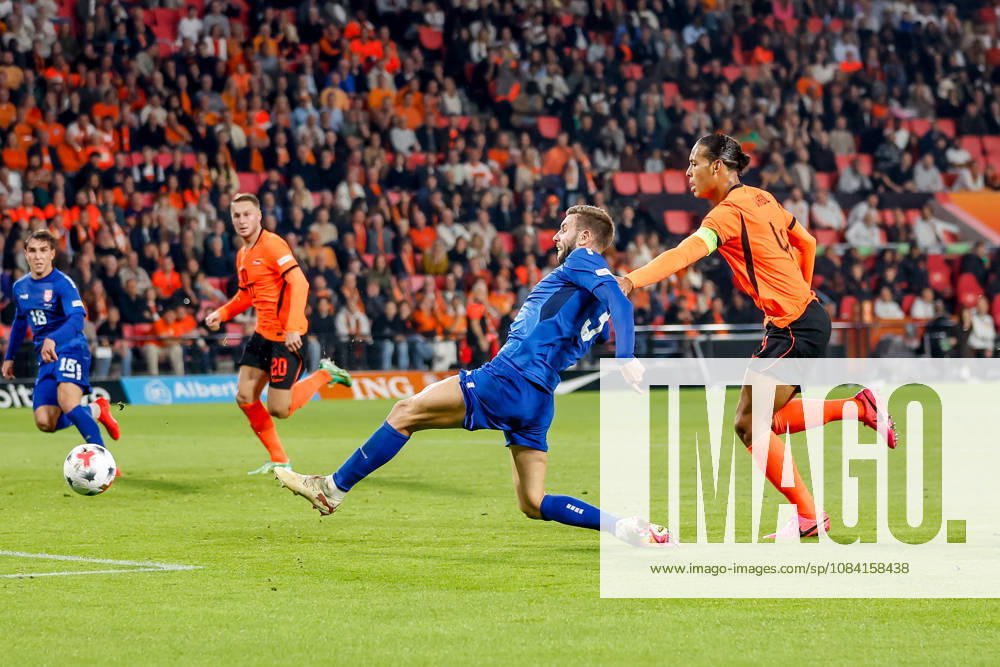 Strahinja Pavlovic of Serbia is challenged by Virgil van Dijk of Netherlands during the UEFA Nations League 2026 27 Group A2 MD4 match between Netherlands and Serbia at Philips Stadion on October 04, 2026 in Eindhoven, Netherlands.