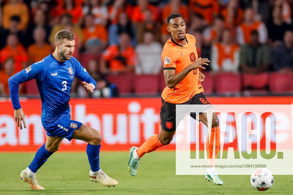 Ryan Gravenberch of Netherlands is challenged by Strahinja Pavlovic of Serbia during the UEFA Nations League 2026 27 Group A2 MD4 match between Netherlands and Serbia at Philips Stadion on October 04, 2026 in Eindhoven, Netherlands.
