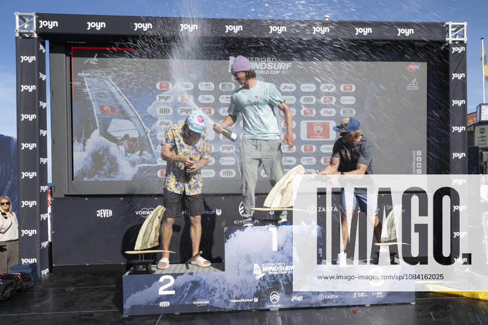 PWA Citroën World Windsurfing Tour Sylt 2026 Day 9 Award Ceremonies: Slalom Foil Men and Freestyle Men Sylt Westerland, October 4, 2026 Balz Müller, Freestyle Men, Switzerland, SUI 21 Lennert Neubauer, Freestyle Men, Greece, GRE 734 Yentel Caers, Freestyle Men, Belgium, B 16 PWA Citroën World Windsurfing Tour Sylt 2026 Day 9 Award Ceremonies for Slalom Foil Men and Freestyle Men on October 4, 2026, in front of Brandenburger Beach, motorboat on Sylt, Westerland, Germany