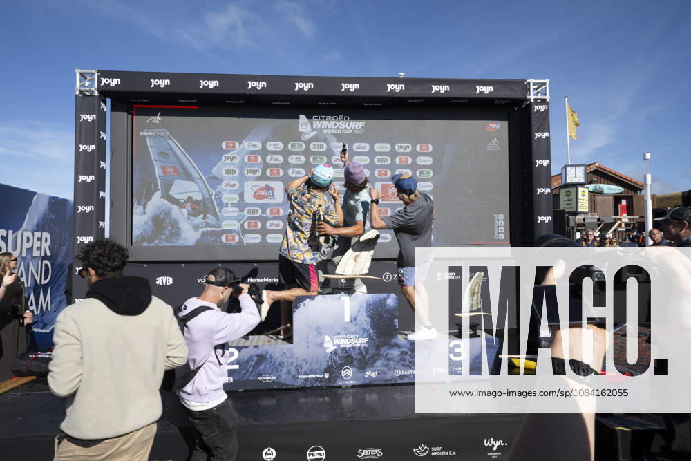 PWA Citroën World Windsurfing Tour Sylt 2026 Day 9 Award Ceremonies: Slalom Foil Men and Freestyle Men Sylt Westerland, October 4, 2026 Balz Müller, Freestyle Men, Switzerland, SUI 21 Lennert Neubauer, Freestyle Men, Greece, GRE 734 Yentel Caers, Freestyle Men, Belgium, B 16 PWA Citroën World Windsurfing Tour Sylt 2026 Day 9 Award Ceremonies for Slalom Foil Men and Freestyle Men on October 4, 2026, in front of Brandenburger Beach, motorboat on Sylt, Westerland, Germany