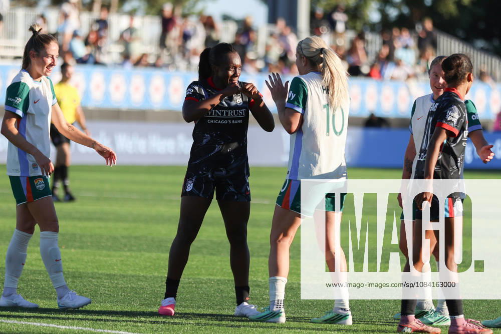 Michelle Alozie (5 Chicago Stars FC) and Lindsey Heaps (10 Denver Summit FC) are seen joking after the game between the Chicago Stars FC and Denver Summit FC at Northwestern Medicine Field at Martin Stadium on Sunday, October 4 in Evanston, USA