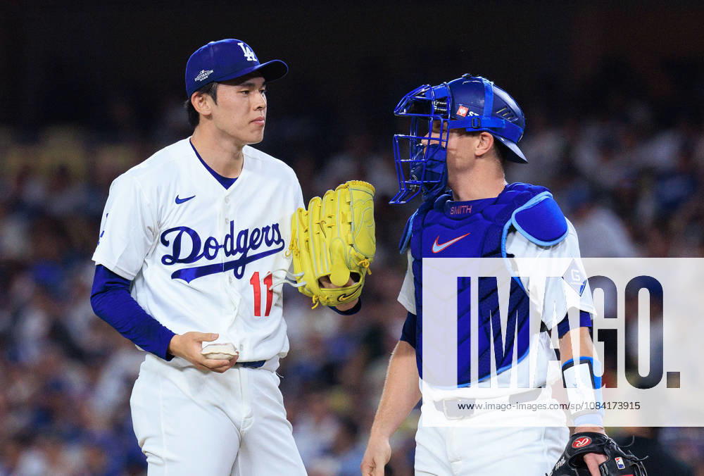 Relief pitcher, Roki Sasaki 11 of the Los Angeles Dodgers chats with Will Smith 16 at a NLDS Game 2 against the Atlanta Braves on Sunday October 4, 2026 at Dodger Stadium in Los Angeles, California. JAVIER ROJAS PI Dodgers Vs. Braves NLDS - Game 2 - ZUMAp124 20261004_zaa_p124_006
