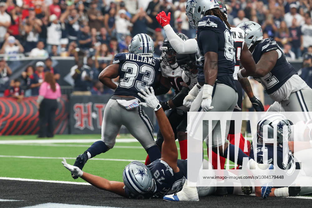 HOUSTON, TX - OCTOBER 04: Running back Javonte Williams 33 of the Dallas Cowboys scores a touchdown as offensive tackle Terence Steele 78 of the Dallas Cowboys holds his arms in the air signaling same during the NFL, American Football Herren, USA football game between the Houston Texans and Dallas Cowboys on October 4, 2026, at Reliant Stadium in Houston, TX. (Photo by David Buono Icon Sportswire) NFL: OCT 04 Cowboys at Texans Icon241004205