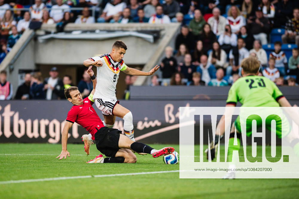 U-21 European Championship Qualifier: Germany vs. Georgia, October 6, 2026: Nicolò Tresoldi (Germany, No. 9) is tackled by Aleksandre Narimanidze (Georgia, No. 4). Soccer, U-21 European Championship Qualifiers, Matchday 10: Germany vs. Georgia on October 6, 2026, Bielefeld DFB REGULATIONS PROHIBIT ANY USE OF PHOTOGRAPHS AS IMAGE SEQUENCES AND OR QUASI-VIDEO