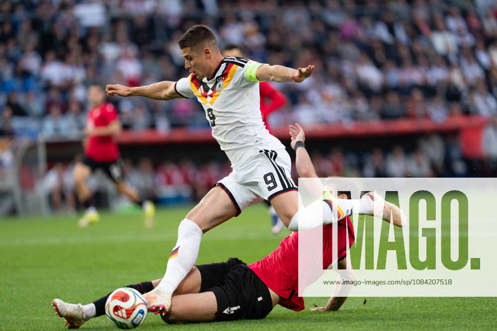 GER, Germany U21 vs. Georgia U21: A duel between Nicolo Tresoldi (Germany U21, No. 9) and Aleksandre Narimanidze (Georgia U21, No. 4), greatsche, Bielefeld SchücoArena, Bielefeld, Germany