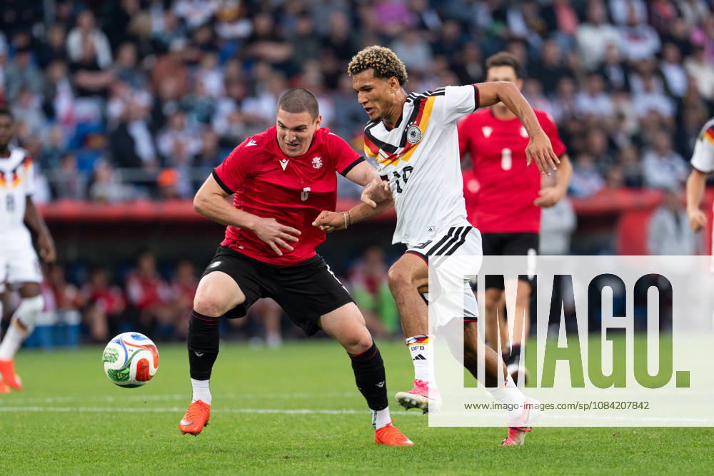 GER, Germany U21 vs. Georgia U21: A duel between Paris Brunner (Germany U21, 19) and Aleksandre Amisulashvili (Georgia U21, 5) at the SchücoArena in Bielefeld, Germany
