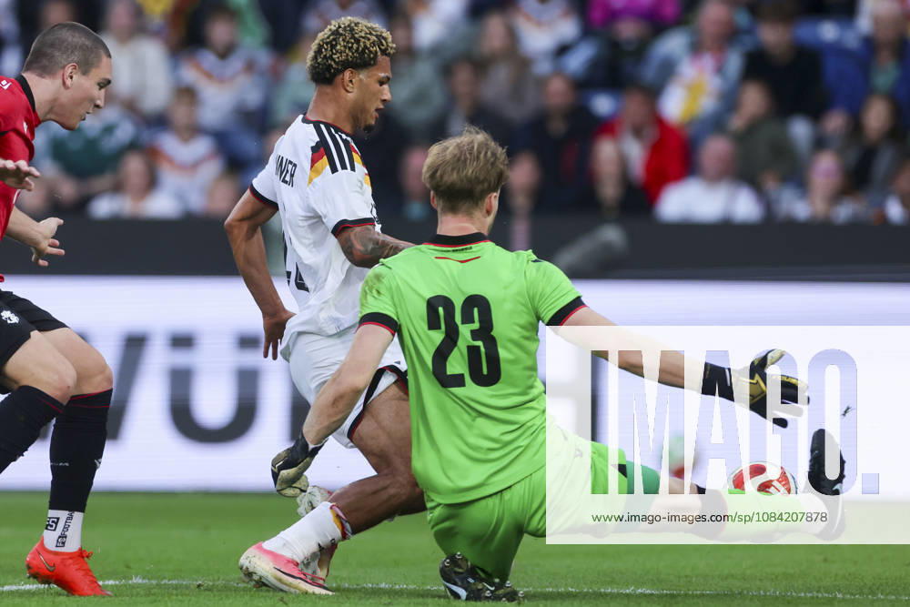 Paris Brunner of Germany and goalkeeper Papuna Beruashvili of Georgia battle for the ball during the UEFA Under-21 EURO qualifier between Germany U21 and Georgia U21 at Almstadion on October 6, 2026, in Bielefeld, Germany. Photo by Marco Steinbrenner, DeFodi Images