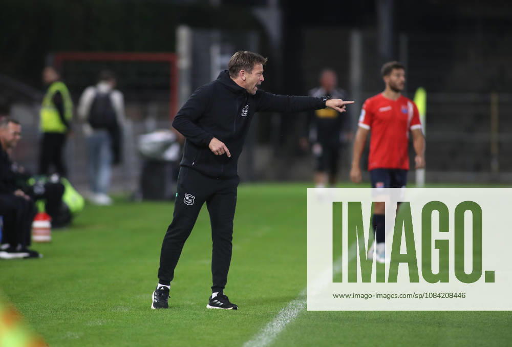 Soccer, Men s, Toto Cup, Quarterfinals, 2026–2027 Season, SpVgg Unterhaching vs. SSV Jahn Regensburg, Sportpark Unterhaching; Holger Seitz, coach of SpVgg Unterhaching, standing on the sideline, raises his left arm