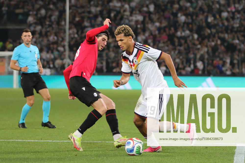 Men s Soccer 2026–2027 UEFA U-21 European Championship Qualifiers Matchday 12 Germany vs. Georgia SchücoArena, Bielefeld Paris Brunner, Germany, 19, in white, passes Nikoloz Dadiani of Georgia, 10, in red, in Bielefeld, North Rhine-Westphalia, Germany