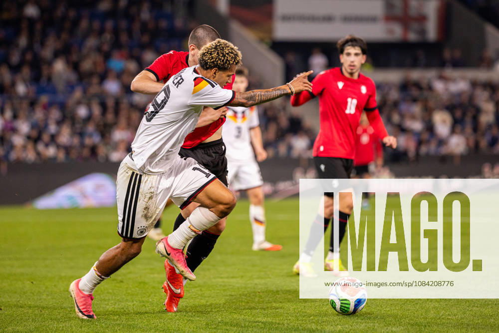 L R Paris Brunner, Germany U21, 19, in a tackle with Aleksandre Amisulashvili, Georgia U21, 05, in the background: GER, Germany vs. Georgia, GEO, Soccer, UEFA U21 European Championship Qualifiers, Group F, Matchday 13, 2026–2027 season, October 6, 2026 GER, Germany GER vs. Georgia GEO, soccer, UEFA U21 European Championship Qualifiers, Group F, Matchday 13, 2026–2027 season, October 6, 2026 Bielefeld
