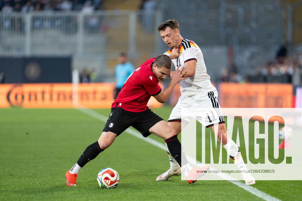 GER, Germany U21 vs. Georgia U21: A duel between Dzenan Pejcinovic (Germany U21, No. 11) and Aleksandre Amisulashvili (Georgia U21, No. 5) at the SchücoArena in Bielefeld, Germany