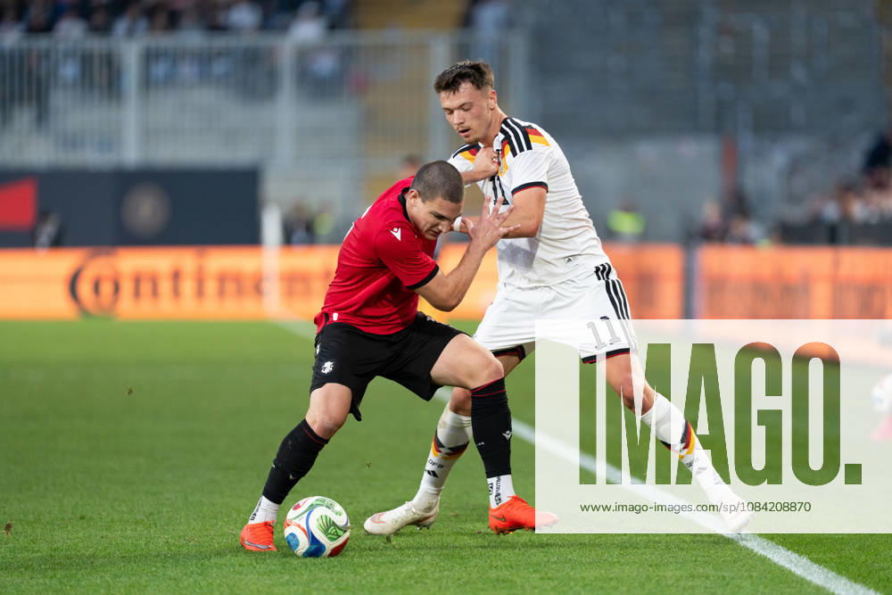 GER, Germany U21 vs. Georgia U21: A duel between Dzenan Pejcinovic (Germany U21, No. 11) and Aleksandre Amisulashvili (Georgia U21, No. 5) at the SchücoArena in Bielefeld, Germany