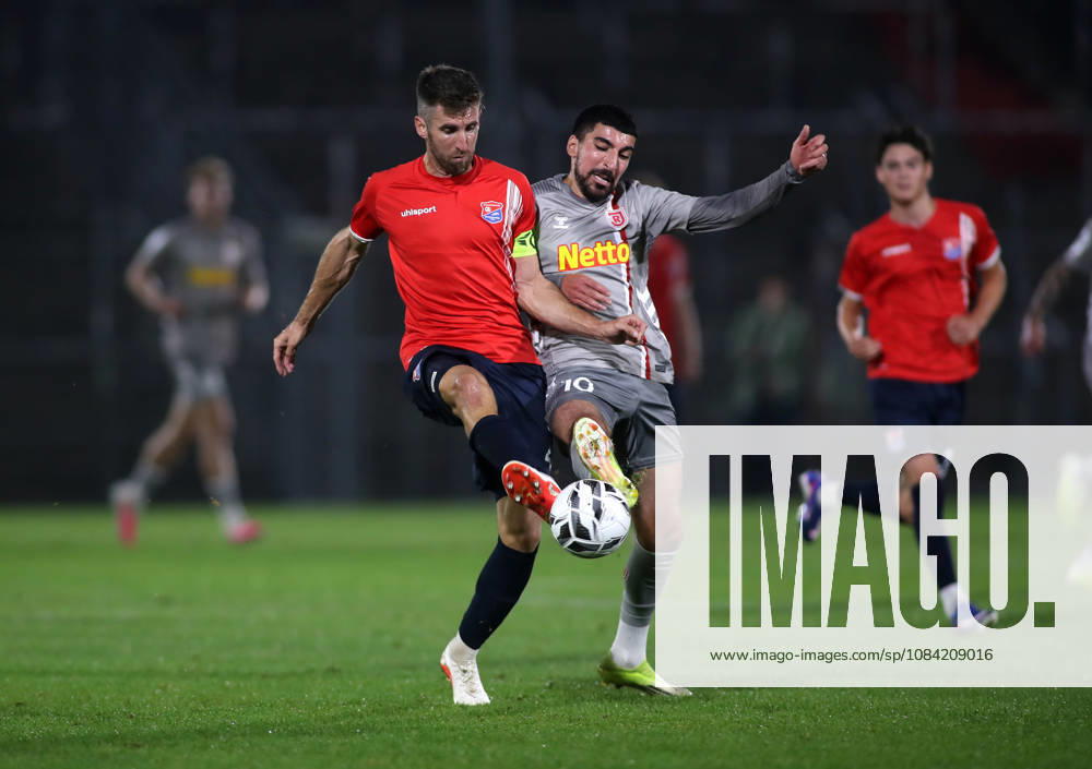 Soccer, Men s, Toto Cup, Quarterfinals, 2026–2027 Season, SpVgg Unterhaching vs. SSV Jahn Regensburg, Sportpark Unterhaching: Alexander Winkler (SpVgg Unterhaching, left) and Nassim Boujellab (SSV Jahn Regensburg, right) battle for the ball