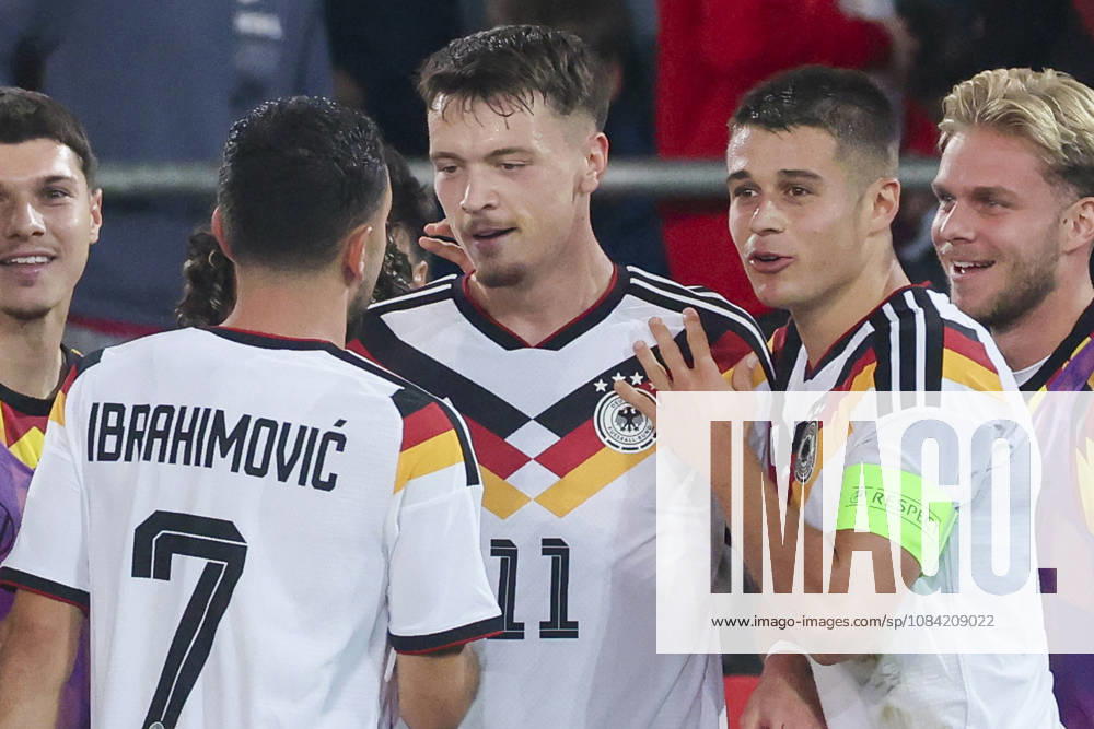 Dzenan Pejcinovic (Germany) celebrates after scoring his team s second goal alongside Arijon Ibrahimovic (Germany) and Nicolo Tresoldi (Germany) during the UEFA Under-21 EURO qualifier between Germany U21 and Georgia U21 at Almstadion on October 6, 2026 in Bielefeld, Germany. Photo by Marco Steinbrenner, DeFodi Images