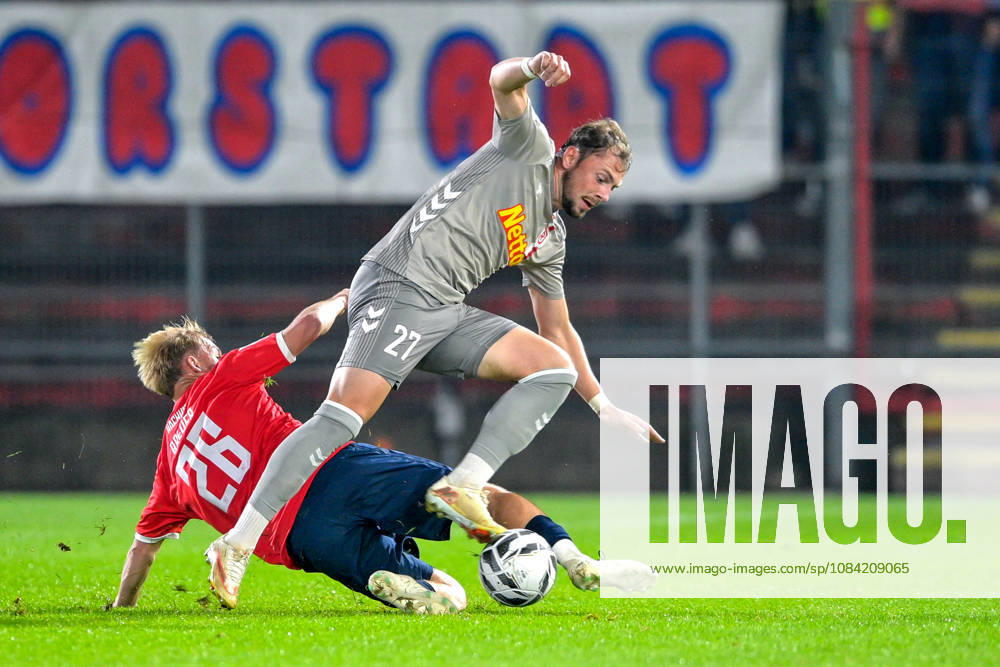 V li Andy Breuer Unterhaching, 26 Lucas Hermes Regensburg, 27 in a one-on-one, duel, tackle, dynamic, action, October 6, 2026, Unterhaching, Germany, soccer, BFV Association Cup, quarterfinals, SpVgg Unterhaching vs. SSV Jahn Regensburg