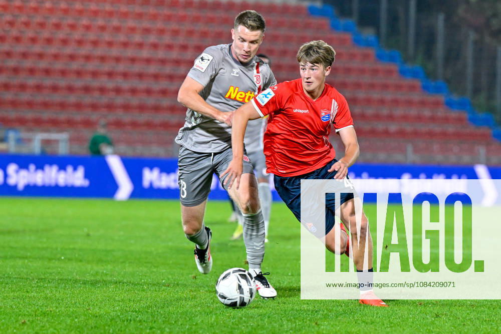 V li Erik Majetschak Regensburg, 13 Marinus Spann Unterhaching, 46 in a one-on-one, duel, tackle, dynamic, action, October 6, 2026, Unterhaching, Germany, soccer, BFV Association Cup, quarterfinals, SpVgg Unterhaching vs. SSV Jahn Regensburg