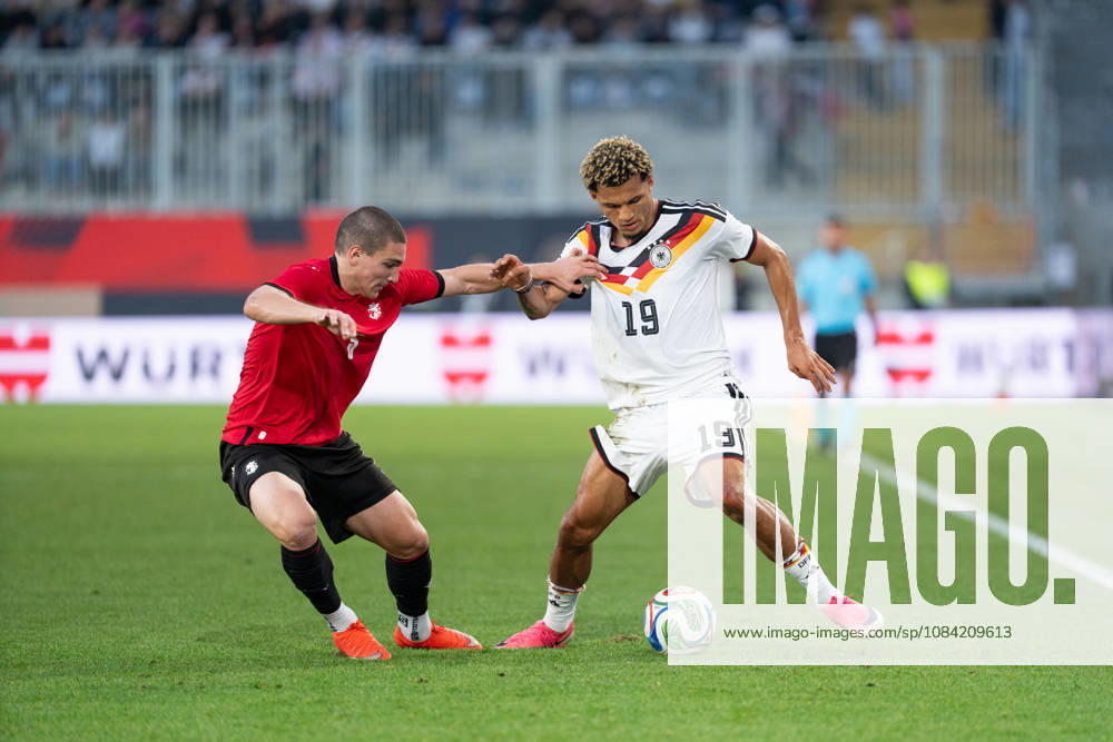 GER, Germany U21 vs. Georgia U21: A duel between Paris Brunner (Germany U21, 19) and Aleksandre Amisulashvili (Georgia U21, 5) at the SchücoArena in Bielefeld, Germany