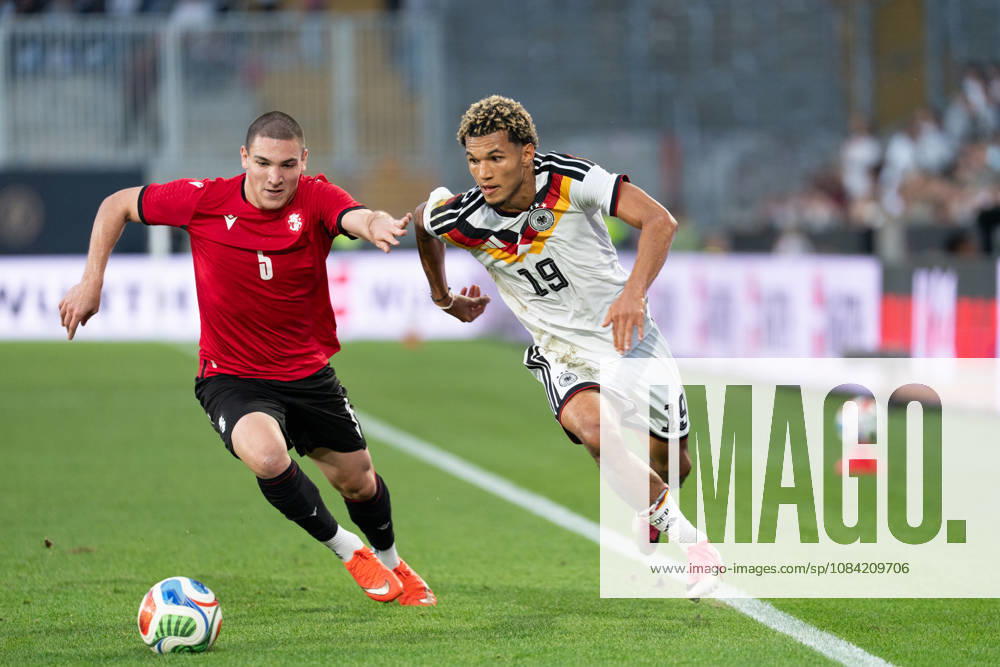 GER, Germany U21 vs. Georgia U21: A duel between Paris Brunner (Germany U21, 19) and Aleksandre Amisulashvili (Georgia U21, 5) at the SchücoArena in Bielefeld, Germany